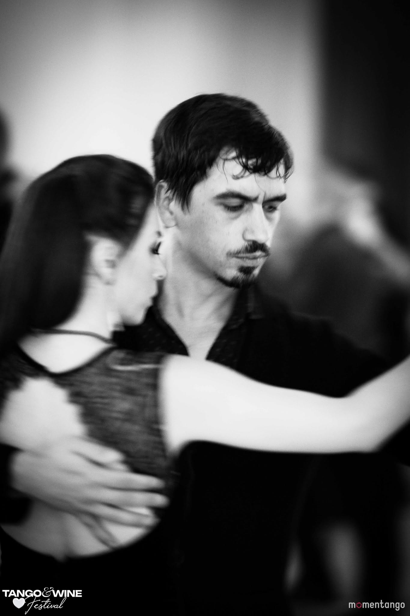 A couple dancing tango in close embrace